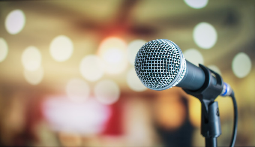 microphone in front of crowd speaking engagements